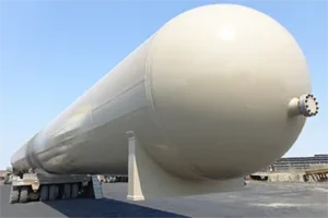 A large white tank sitting on top of a road.