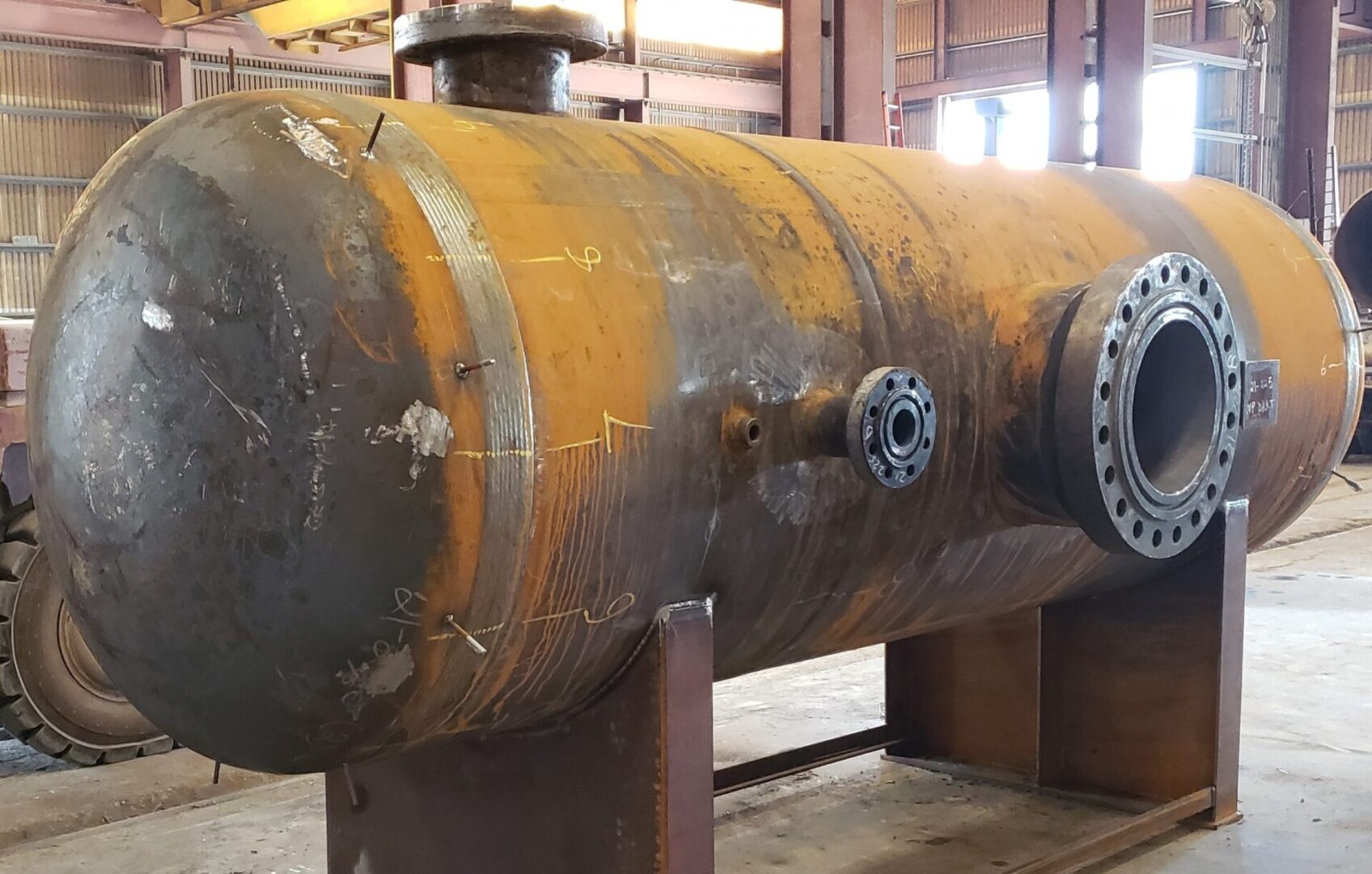 A large metal tank sitting in a building.