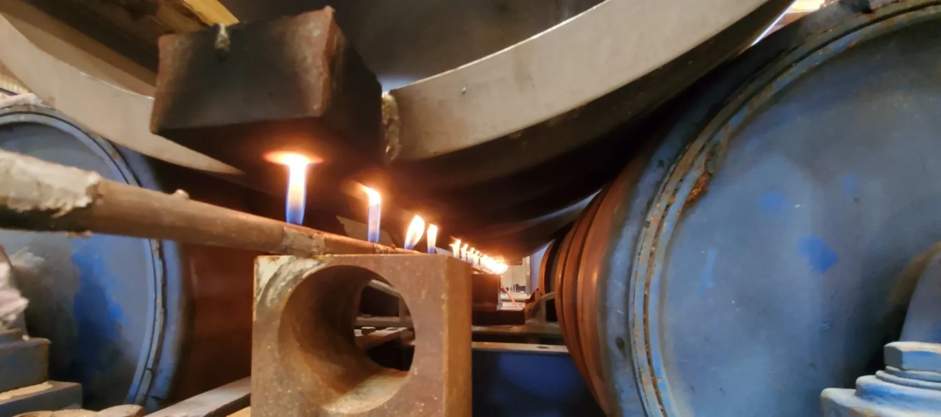 A bunch of candles are lit in the middle of a pipe.