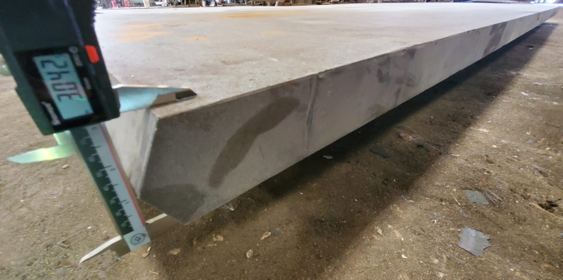 A large metal beam sitting in the middle of a floor.