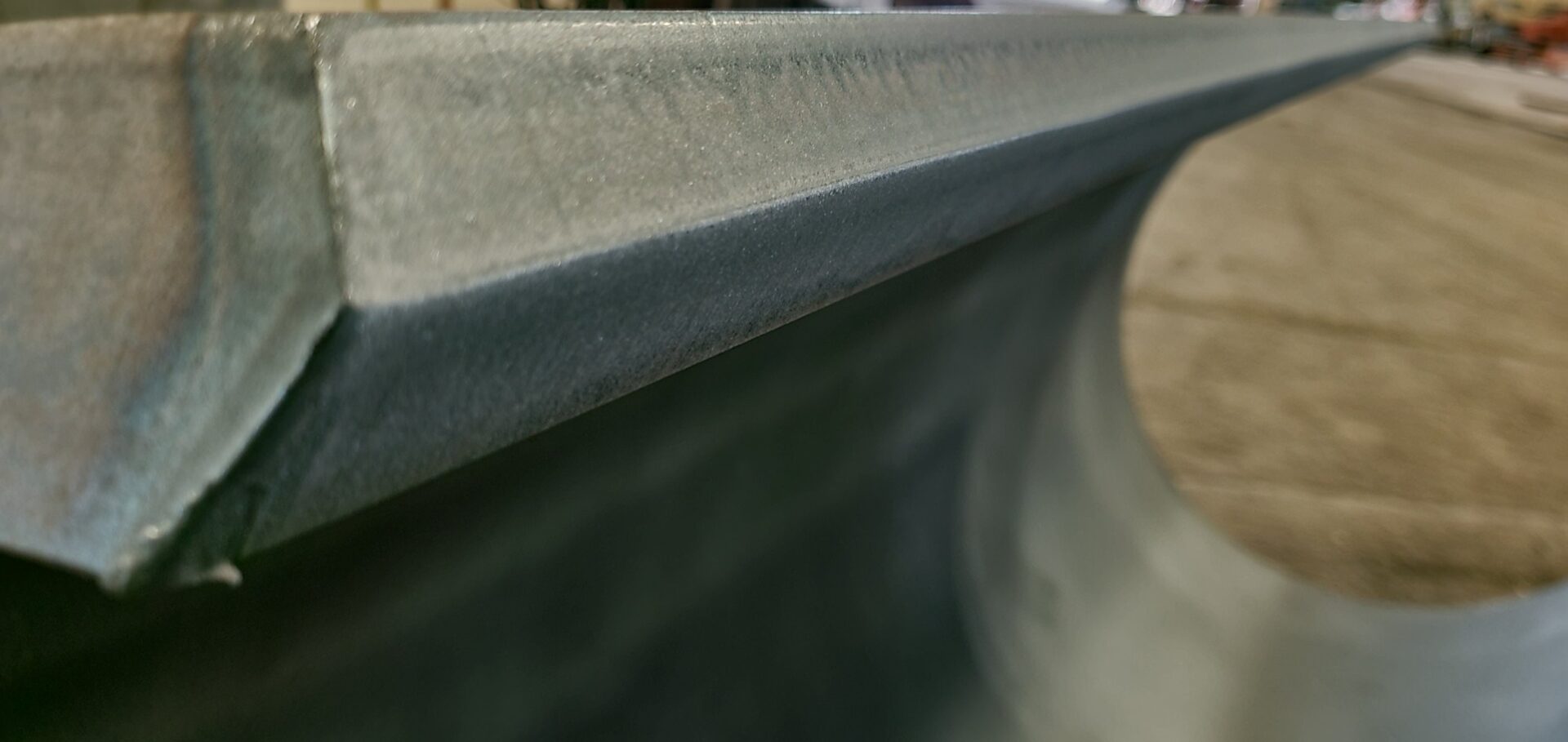 A close up of the edge of a concrete bench