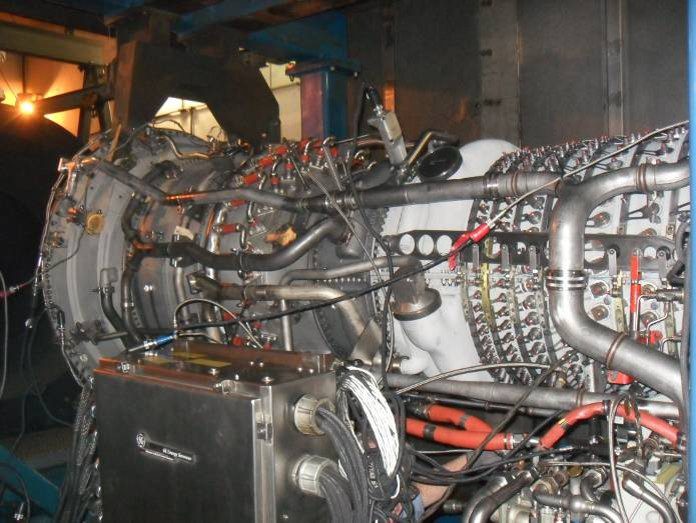 Industrial turbine engine with piping and cables