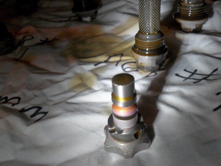 Close-up of metal valve components on fabric