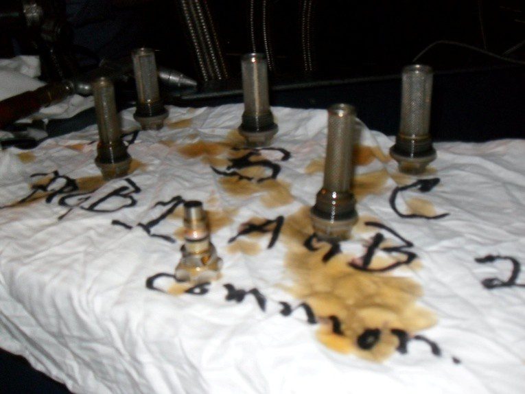 Valve lifters on oil-stained towel